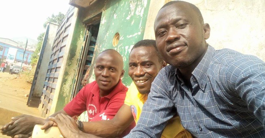 Alusine Deen Sesay (center) and other sport loving fans